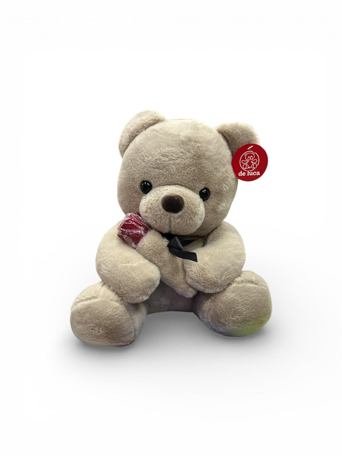 orsacchiotto peluche con rosa in mano